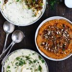 Overhead of three bowls of mashed potatoes