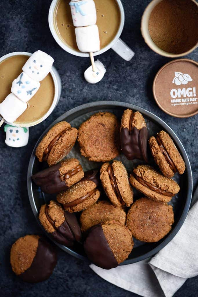 Overhead of hot cocoa gingerbread sandwich cookies