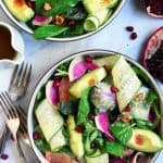 Close up overhead of citrus avocado salad with watermelon radish