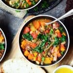 Overhead of lentil vegetable soup in black bowl