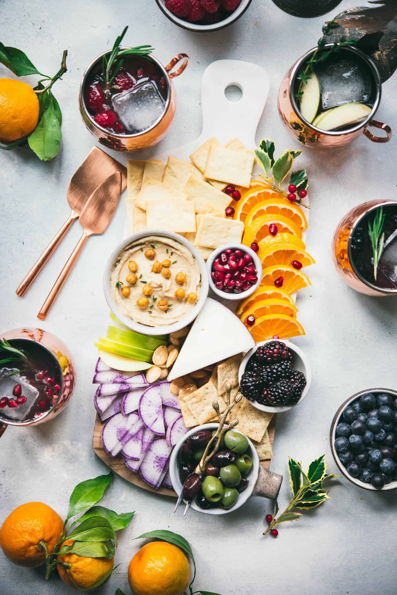 Marble board with cheese and fruits