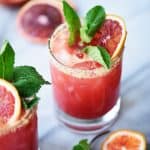 Side view of blood orange kombucha margarita with mint