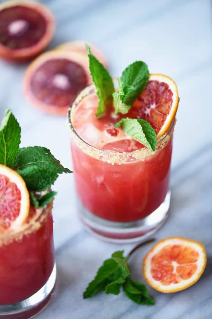 Side view of blood orange kombucha margarita with mint