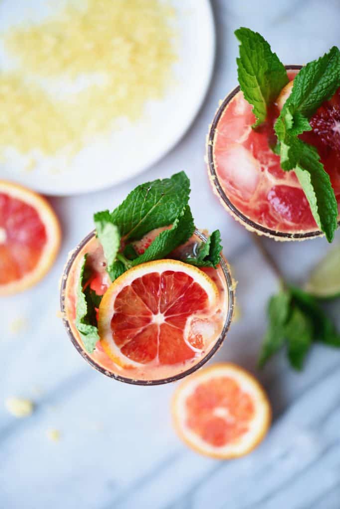 Overhead of blood orange kombucha margarita with mint