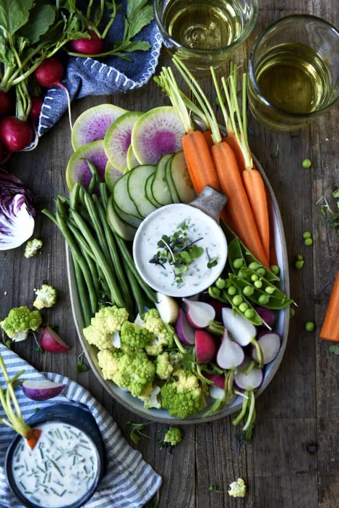 Overhead of vegan ranch on a platter with fresh vegetables
