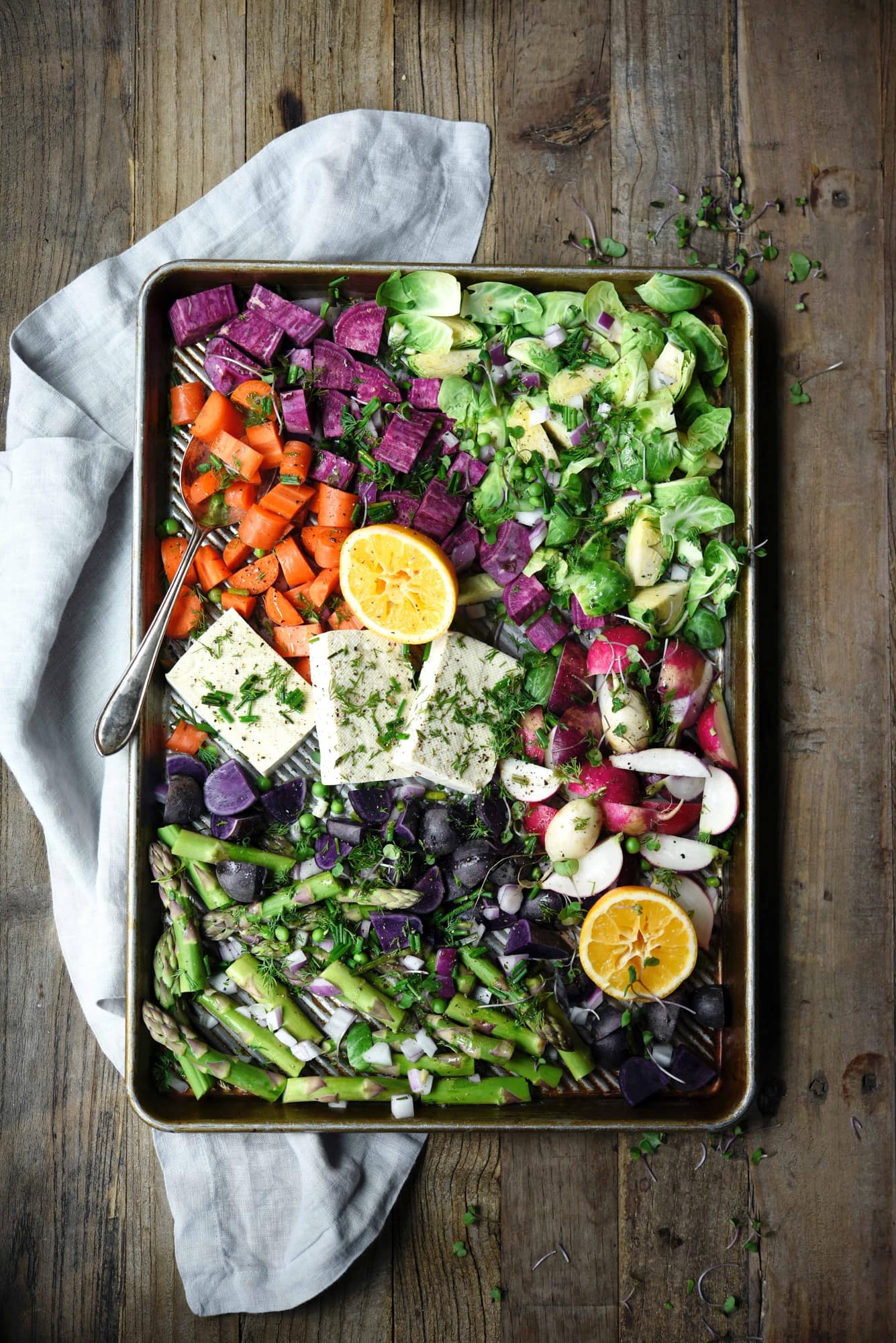 Sheet pan of rainbow roasted spring vegetables and tofu