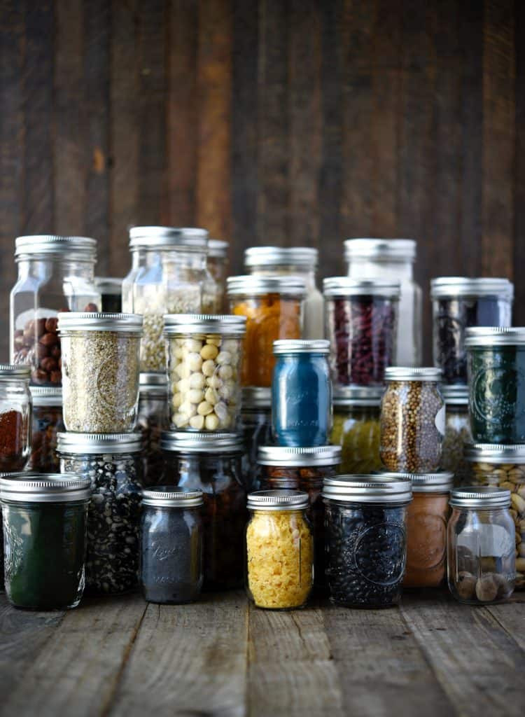 Pantry items in small glass jars to reduce plastic consumption