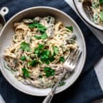 Overhead of vegan mushroom alfredo in a white ceramic bowl
