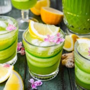 Close up view of cucumber ginger lemonade in a glass.