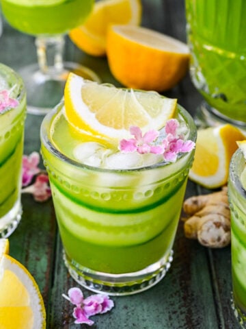 Close up view of cucumber ginger lemonade in a glass.