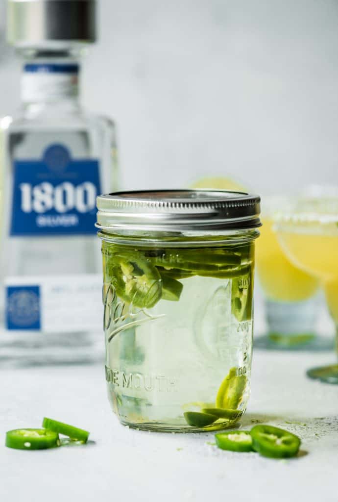 Jalapeno infused tequila in a glass jar