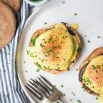 Overhead of vegan eggs benedict on a white plate