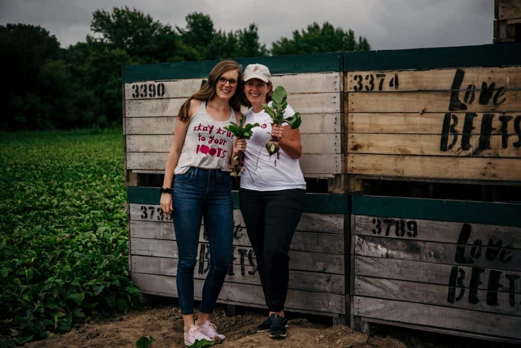 Lexi and Beth in front of the Love Beets crates at their farm in New York
