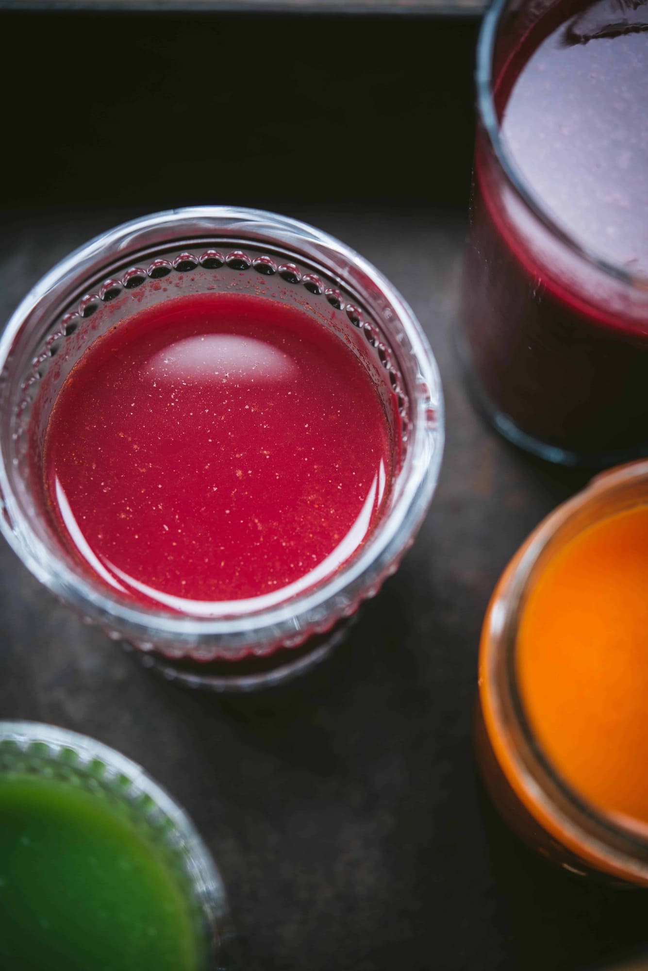 Close up of colorful fresh juices in backlighting