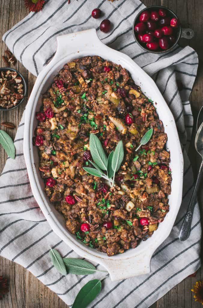 Overhead of gluten free stuffing with fresh sage on a striped linen