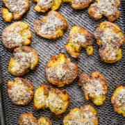 Air fryer smashed potatoes on pan.