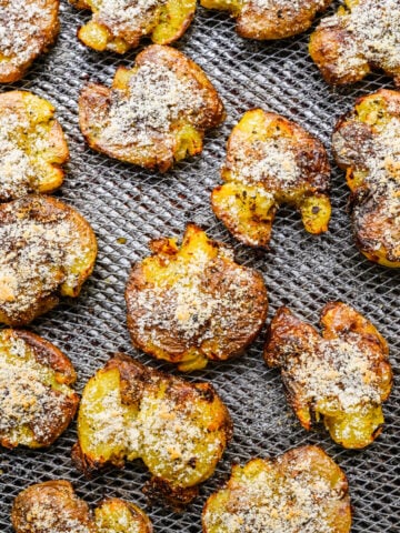 Air fryer smashed potatoes on pan.