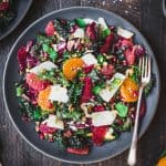 Overhead of kale salad with fresh citrus, parmesan and pistachios