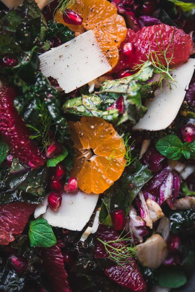 Close up macro shot of kale and citrus salad with mandarins, grapefruit, blood orange and parmesan