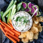 Close up overhead of vegan caramelized onion dip with vegetables
