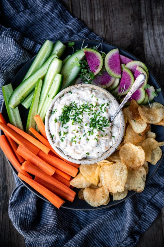 Close up overhead of vegan caramelized onion dip with vegetables