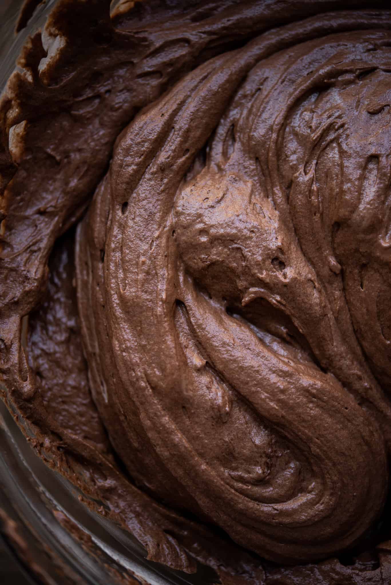 close up view of dark chocolate vegan mousse in bowl