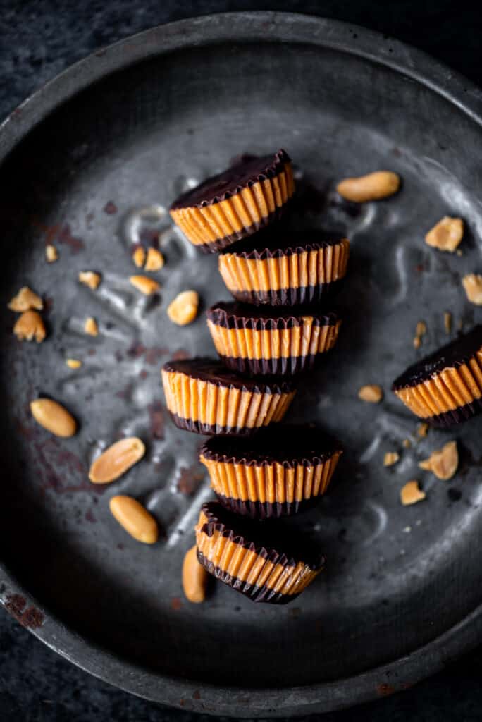 Overhead of vegan peanut butter cups on an antique tray