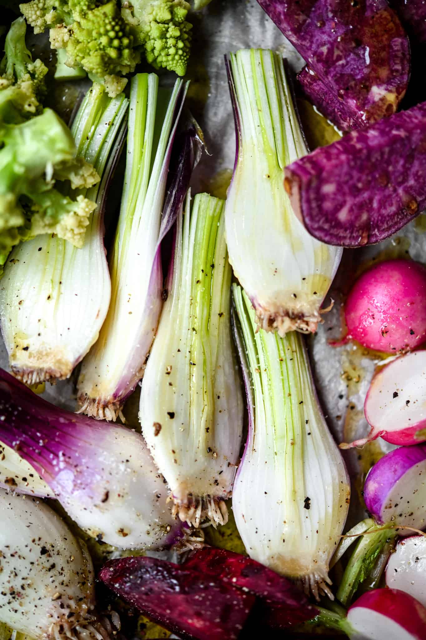 Close up of purple spring onions sliced in half