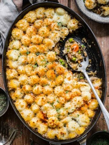 Overhead view of shepherd's pie with a scoop taken out.