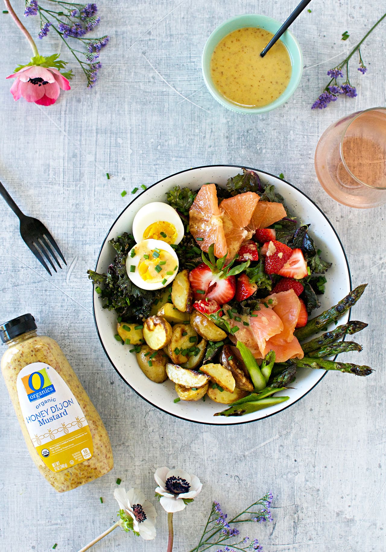 Overhead view of breakfast salad in a bowl with smoked salmon, roasted potatoes and hard boiled eggs