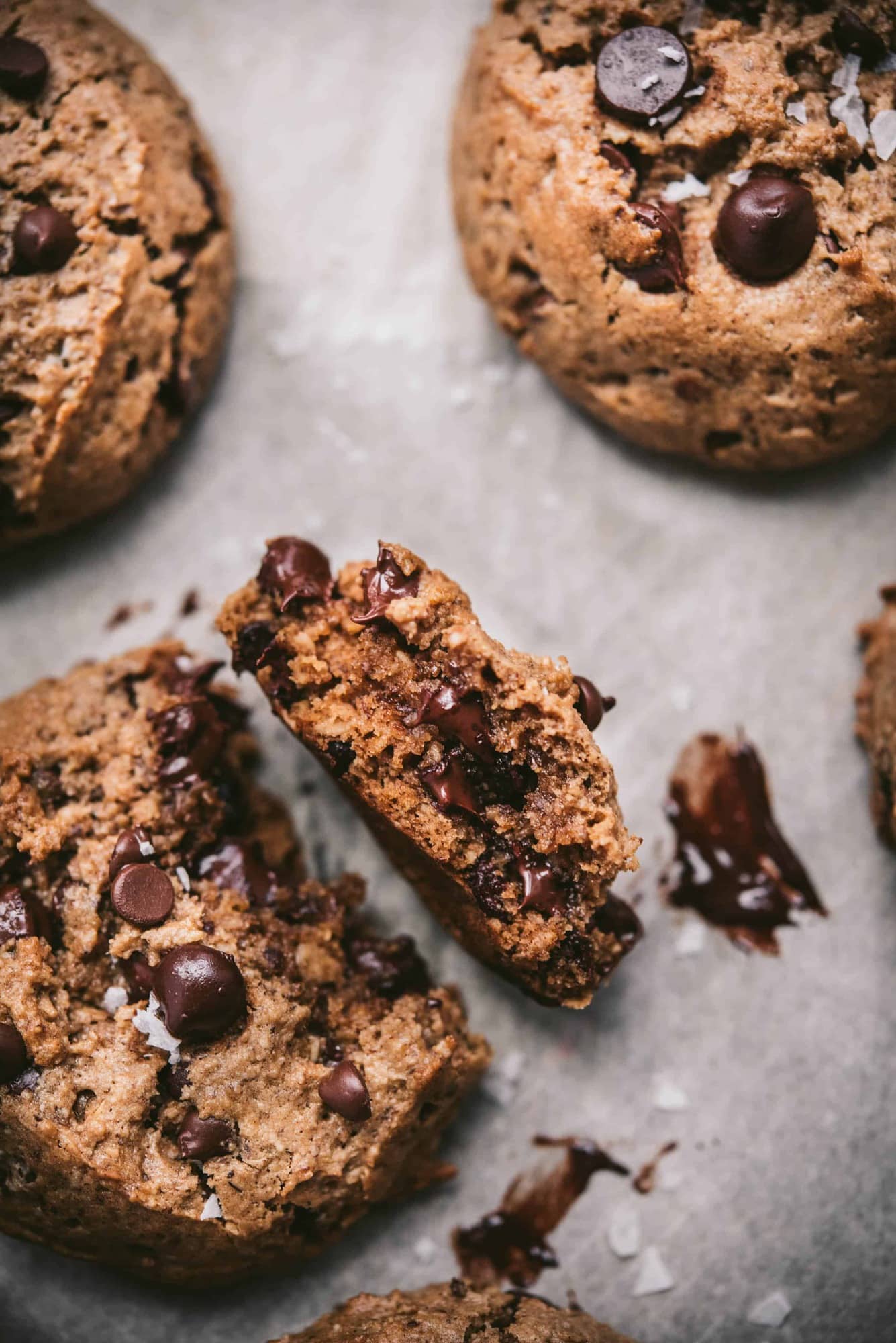 Overhead of inside of chocolate chip oatmeal cookie with melty chocolate chips