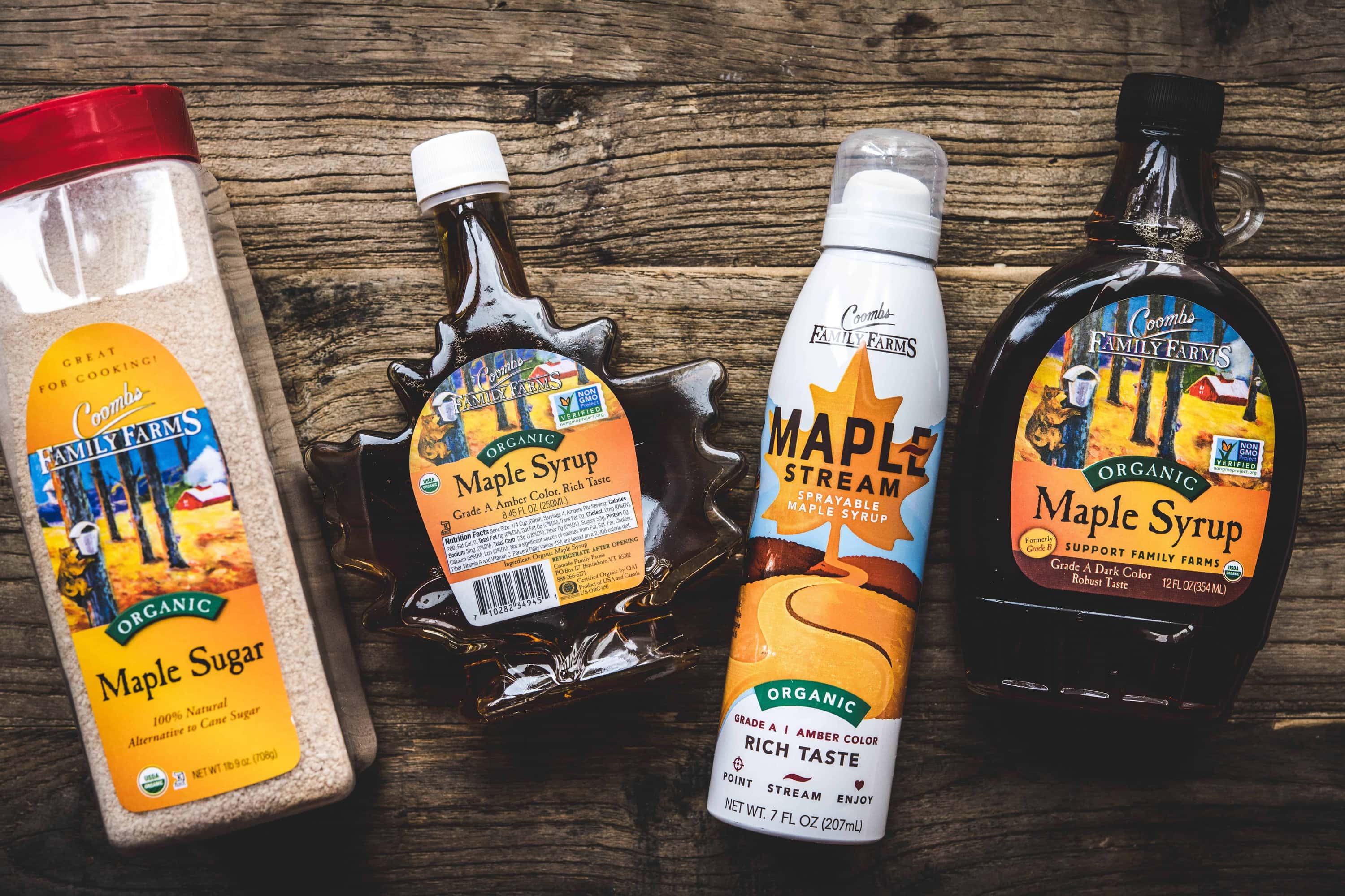 Overhead view of Coombs Family Farms maple syrup products on wood table