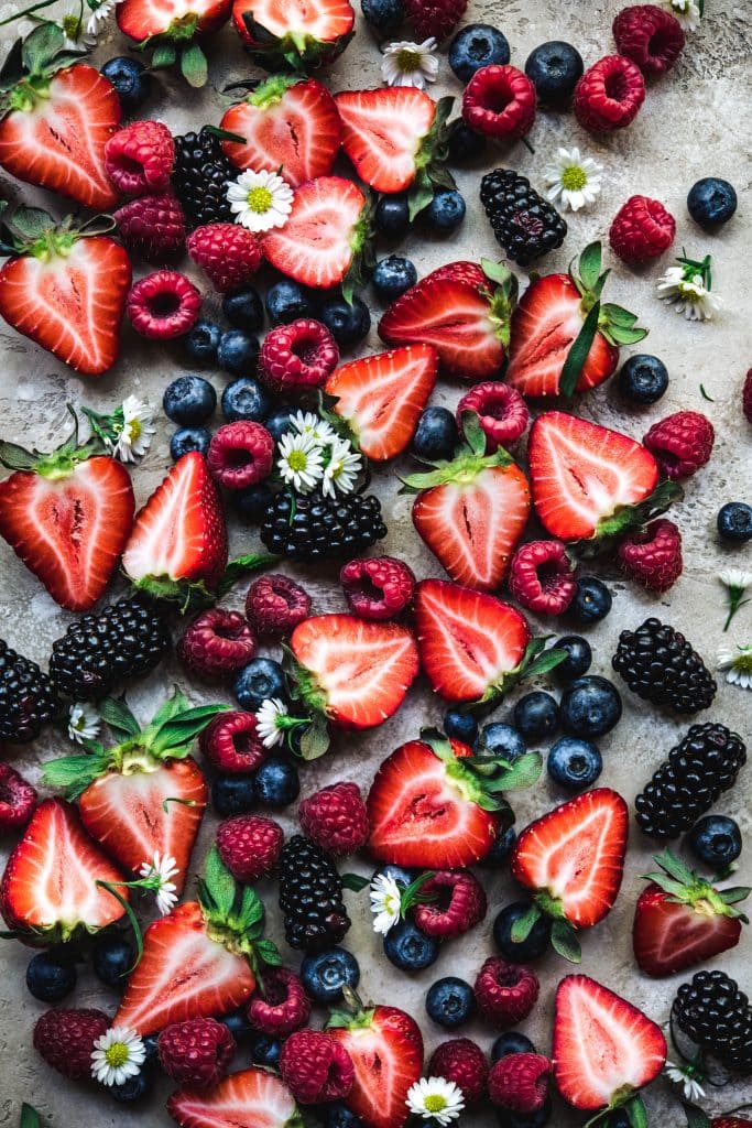 Overhead view of beautiful strawberries, raspberries, blueberries and blackberries