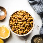 Overhead view of crispy za'atar roasted chickpeas in a white bowl