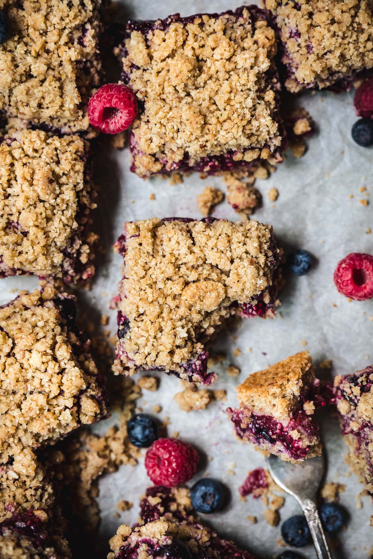 Overhead view of vegan four berry pie bars with streusel topping