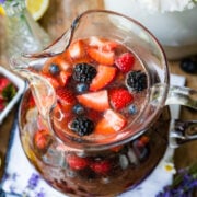 Overhead view of berry sangria in a pitcher.