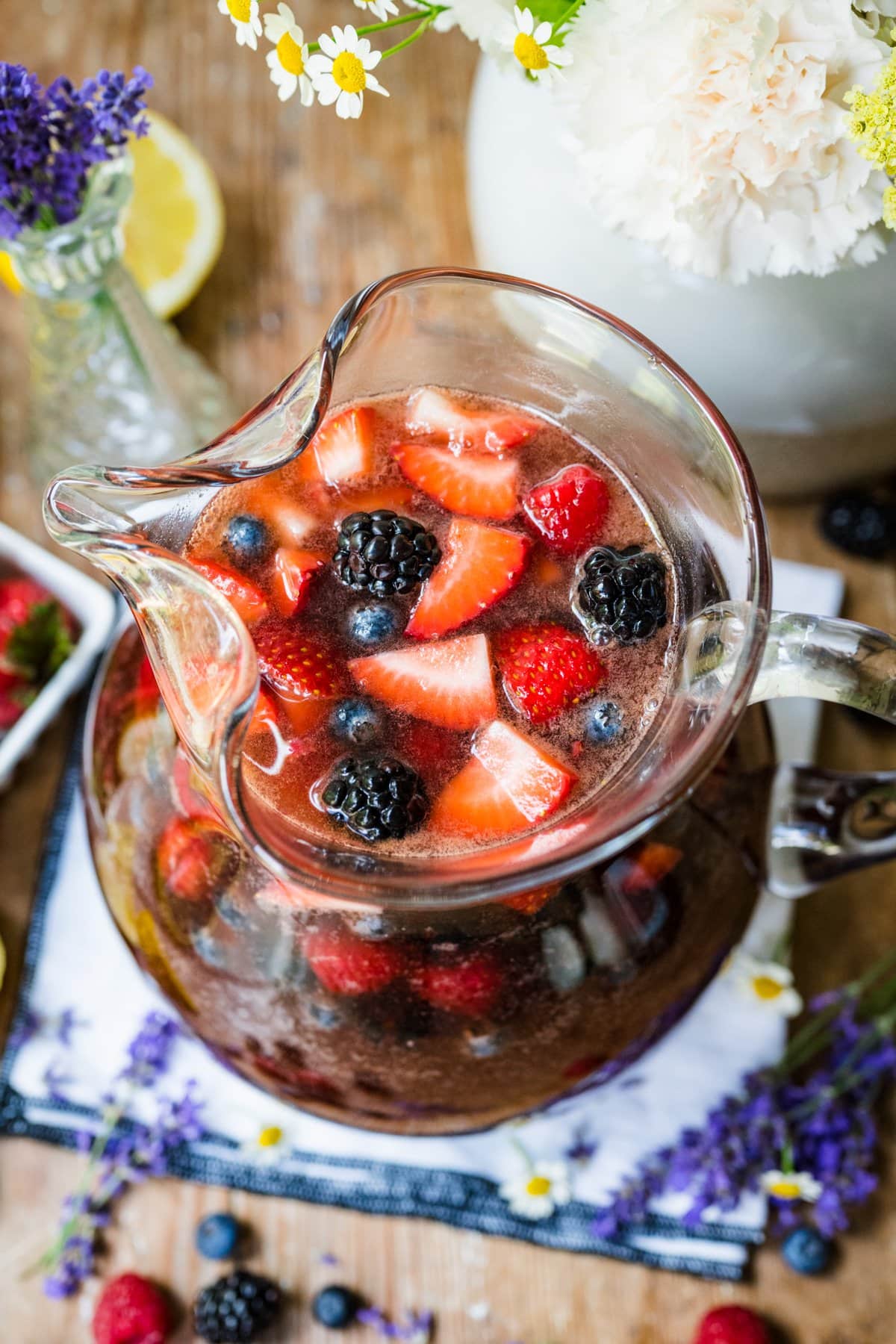 Overhead view of berry sangria in a pitcher.