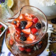 Overhead view of berry sangria in a pitcher.