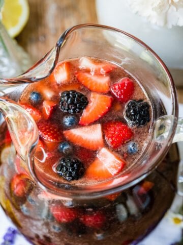 Overhead view of berry sangria in a pitcher.