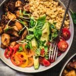 Overhead of vegan breakfast bowl with a fork