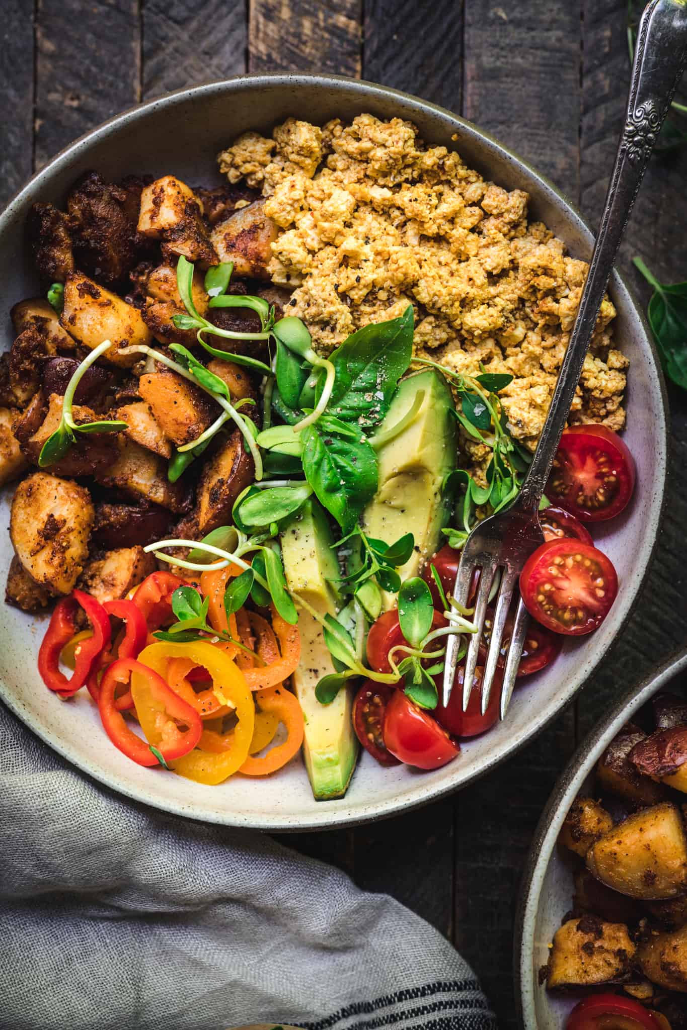 Overhead of vegan breakfast bowl with a fork