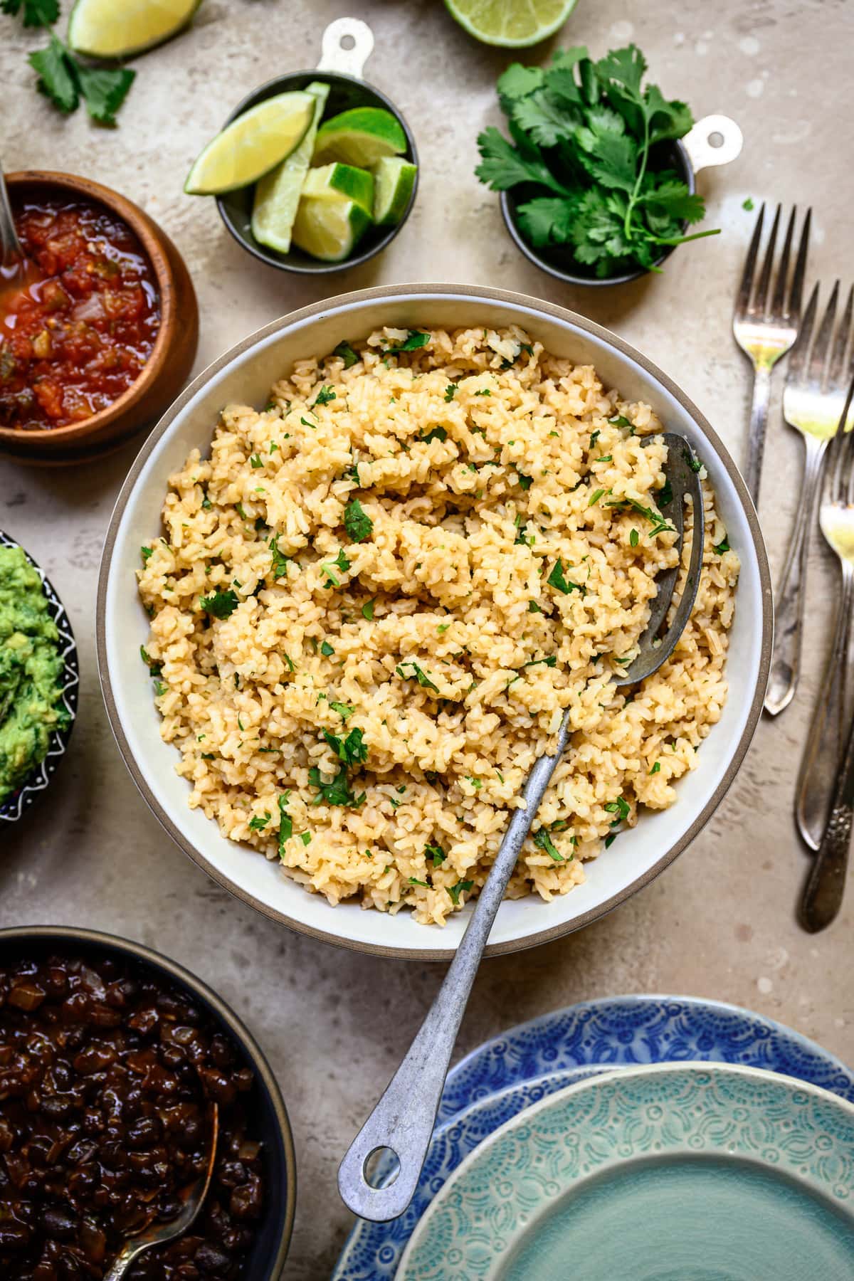 Overhead view of cilantro lime brown rice in white bowl