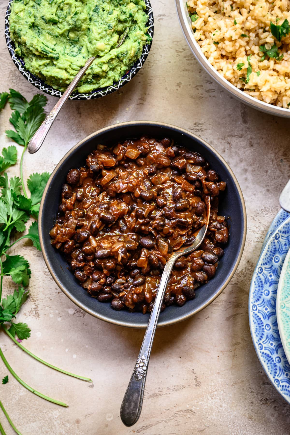 Overhead view of spicy vegan black beans in grey bowl