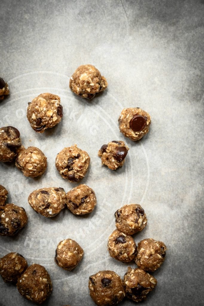 Overhead view of cookie dough bites on parchment paper