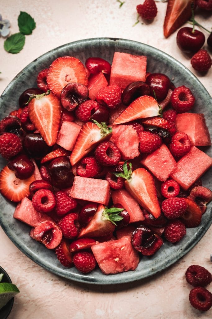 overhead of watermelon berry salad in a bowl