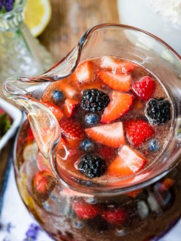 Overhead view of berry sangria in a pitcher.