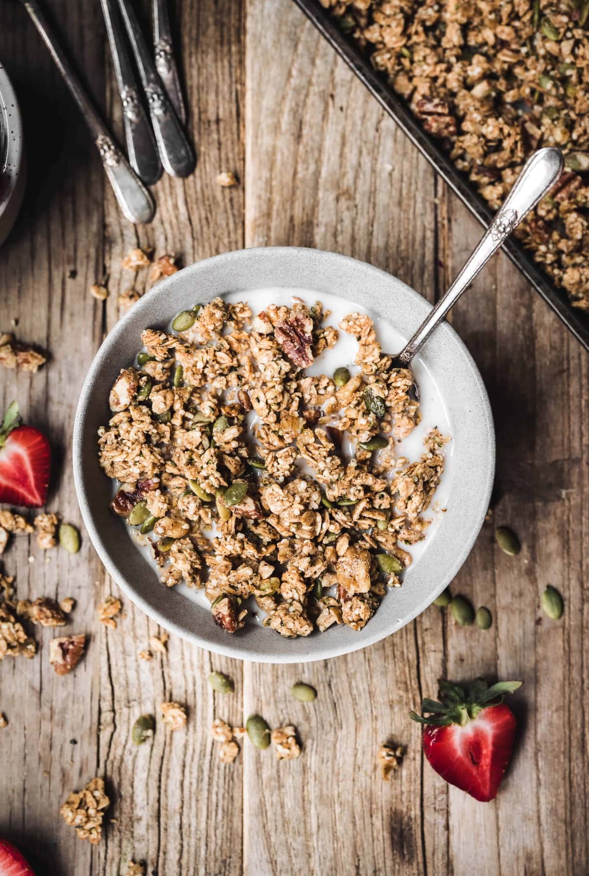 Overhead view of homemade gluten-free granola in a bowl with milk