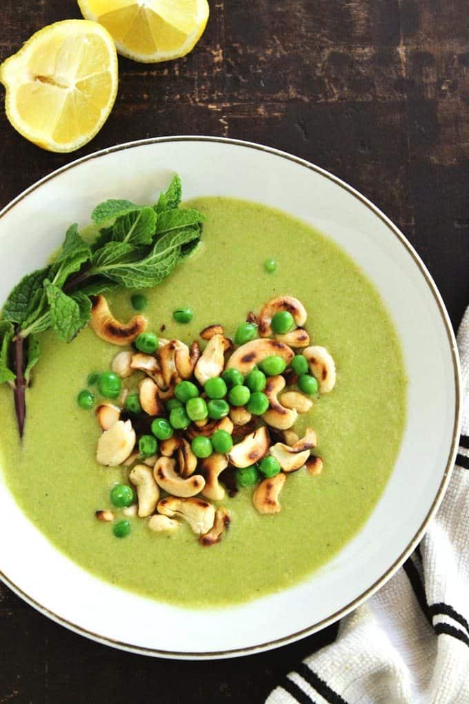 overhead of chilled pea cucumber cashew soup with mint a top vegan chilled soup