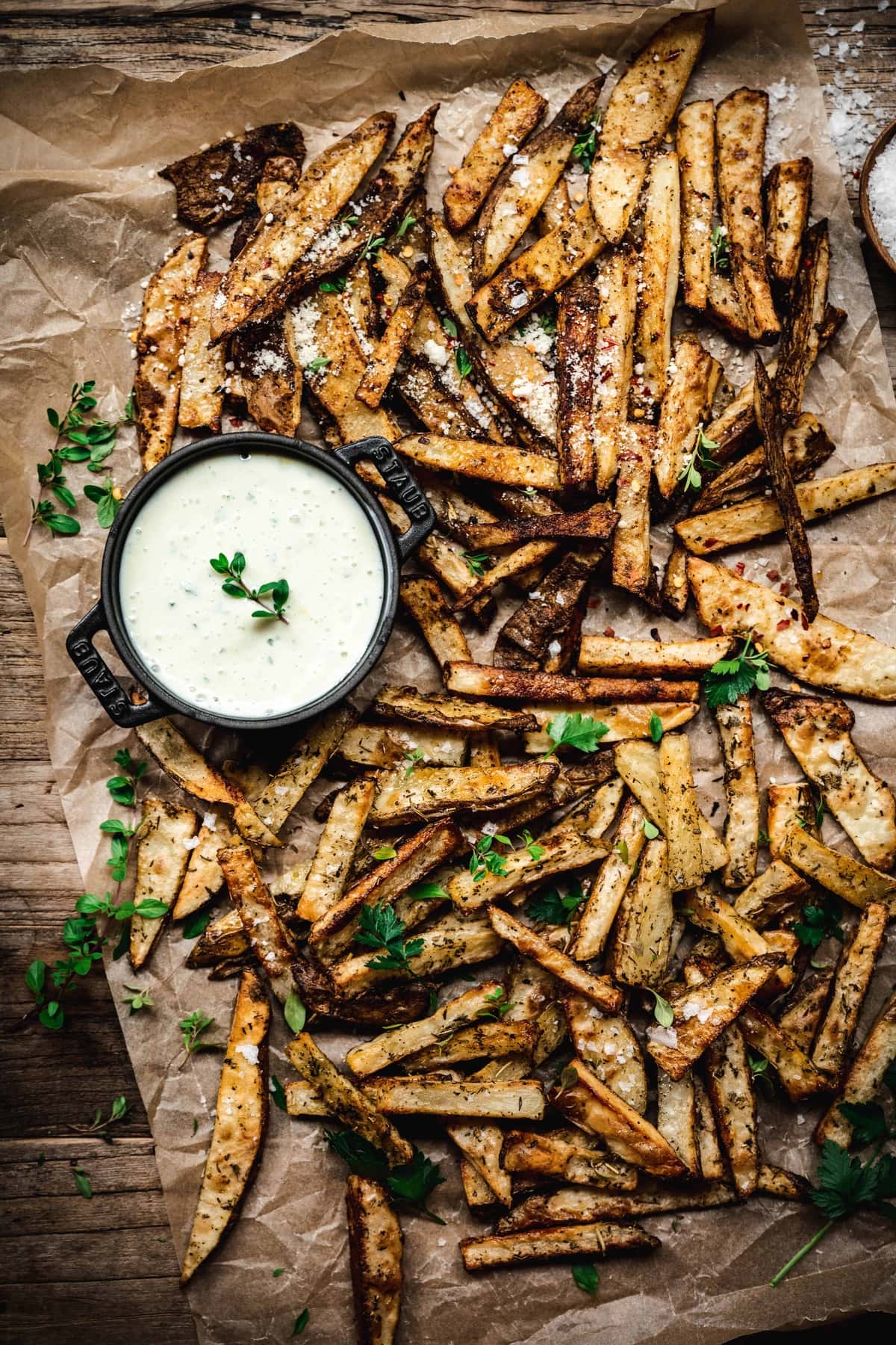 overhead view of super crispy oven fries on parchment paper