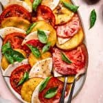 overhead of grilled peach caprese salad with vegan cheese and balsamic dressing
